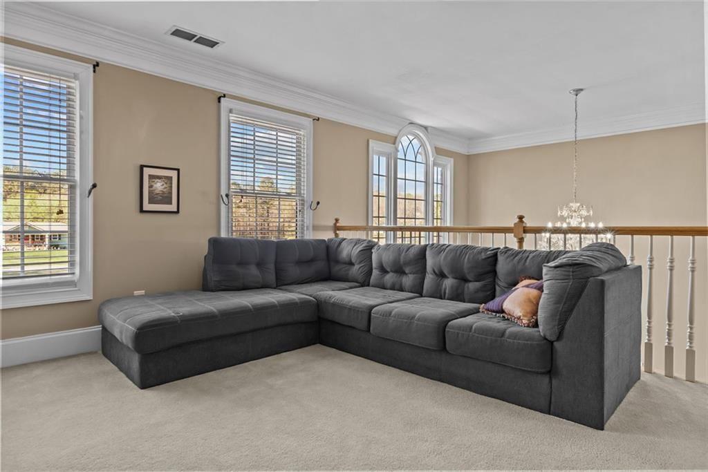 168 Jersey Road Oxford, GA 30054 - Photo 39 of 59 a living room with a couch and a window