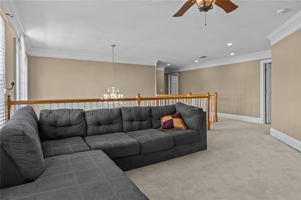 168 Jersey Road Oxford, GA 30054 - Photo 40 of 59 a living room with furniture and a ceiling fan
