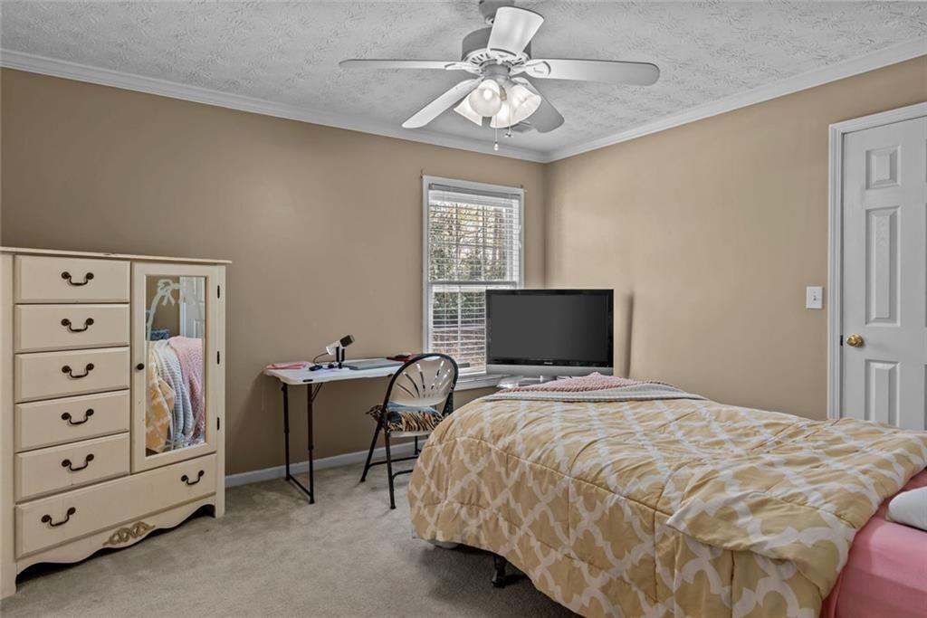 168 Jersey Road Oxford, GA 30054 - Photo 45 of 59 a bedroom with a bed and a television