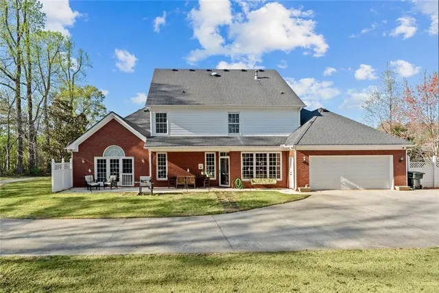 a view of a dining room with furniture and a chandelier