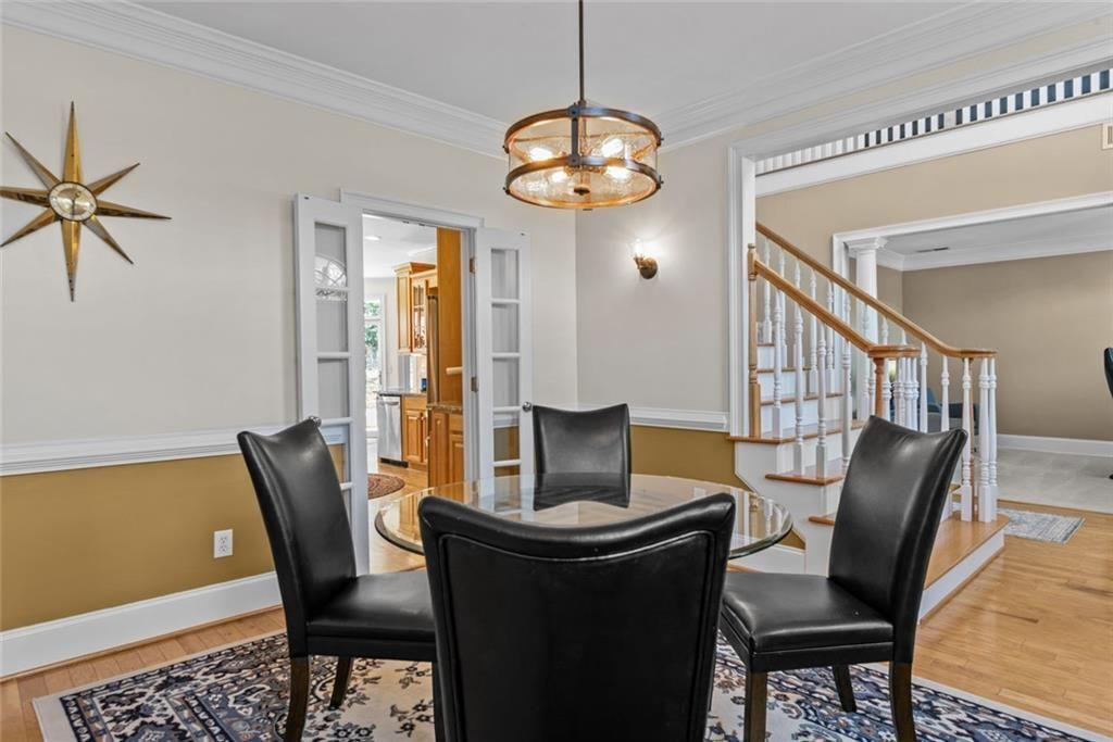 168 Jersey Road Oxford, GA 30054 - Photo 10 of 59 a view of a dining room with furniture and a chandelier