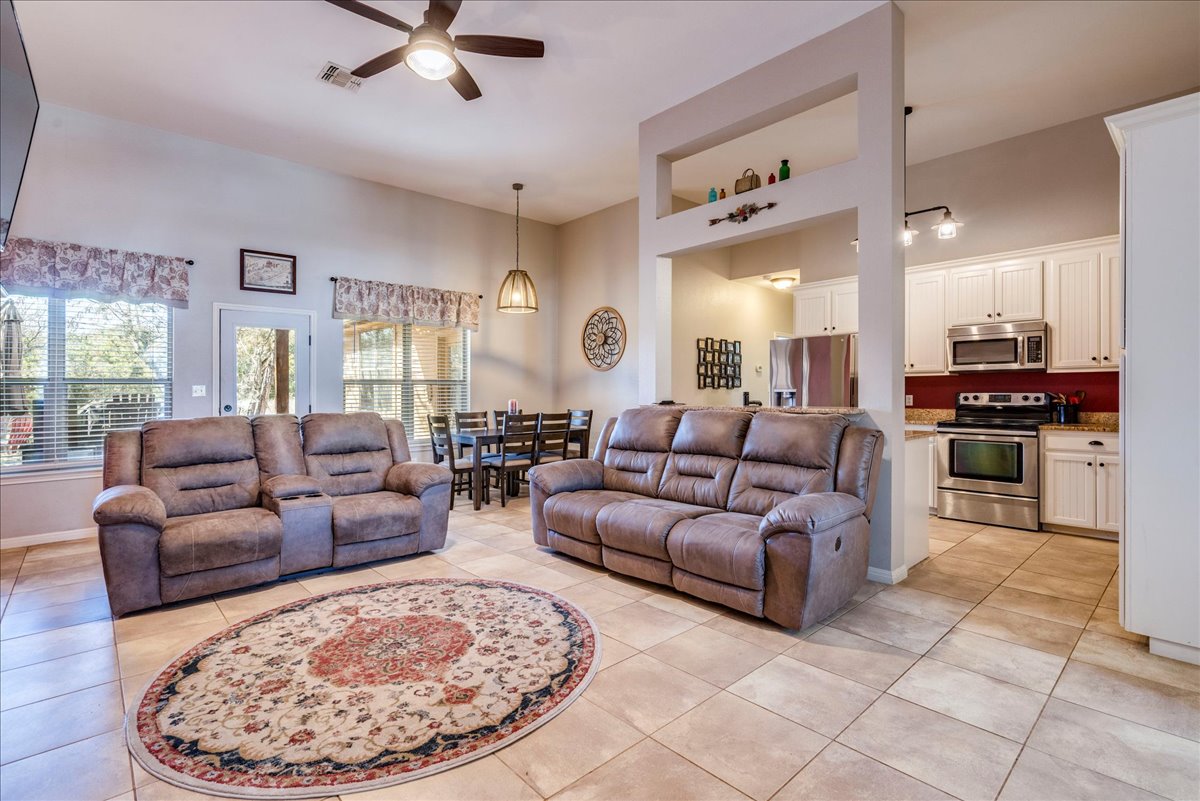 11 Rhapsody Lane Wimberley, TX 78676 - Photo 4 of 35 a living room with furniture and kitchen view