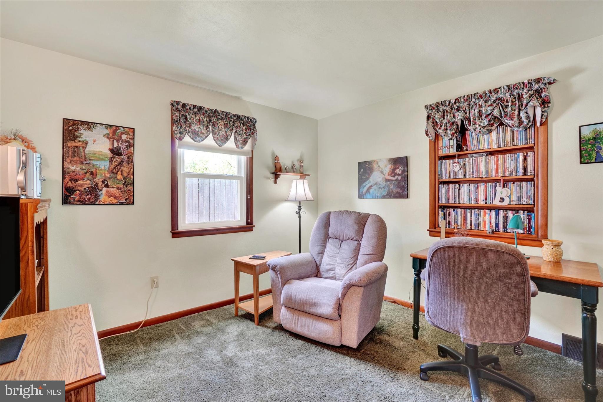 285 South Main Street Mount Wolf, PA 17347 - Photo 22 of 34 a living room with furniture a bookshelf and a window