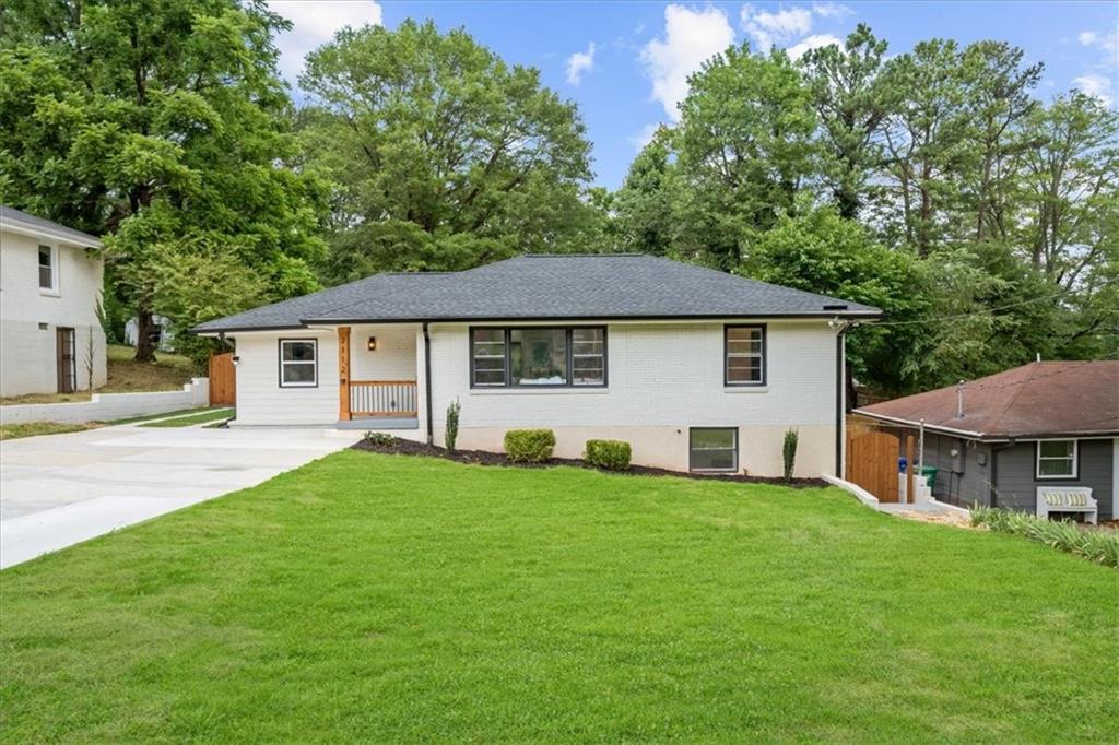 2112 East Drive Decatur, GA 30032 - Photo 1 of 1 a front view of a house with a garden