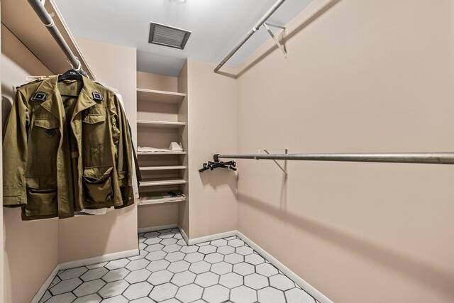 100 Worth Avenue, Unit 415 Palm Beach, FL 33480 - Photo 12 of 34 a view of walk in closet with clothes and shoes
