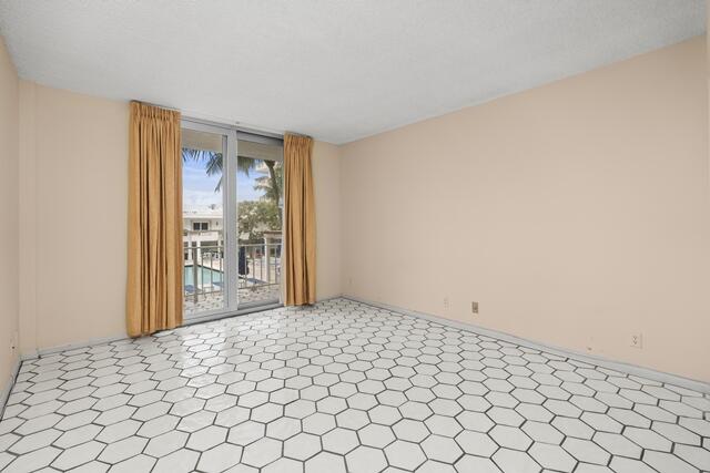 100 Worth Avenue, Unit 415 Palm Beach, FL 33480 - Photo 13 of 34 a view of an empty room and window