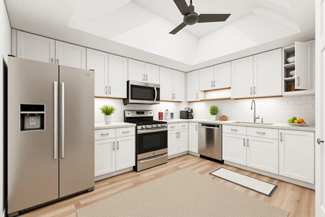 100 Worth Avenue, Unit 415 Palm Beach, FL 33480 - Photo 8 of 34 a kitchen with white cabinets and white appliances