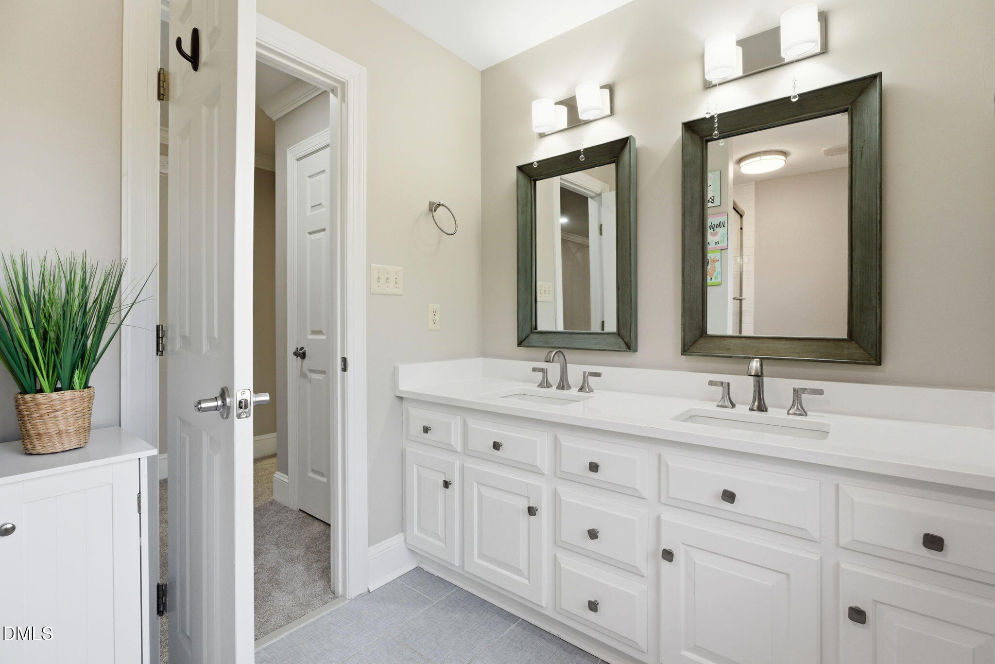 5416 Pulley Town Road Zebulon, NC 27597 - Photo 31 of 74 a bathroom with a double vanity sink mirror and next to a white cabinet