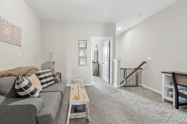 a bedroom with furniture and a wooden floor