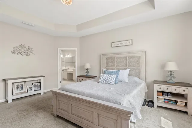 a bedroom with a bed and a cabinets