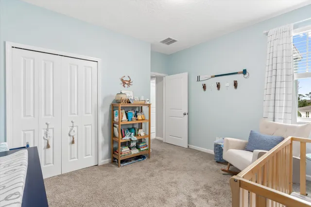 a bed room with furniture and a window