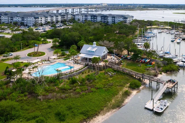 an aerial view of a house with garden space and lake view