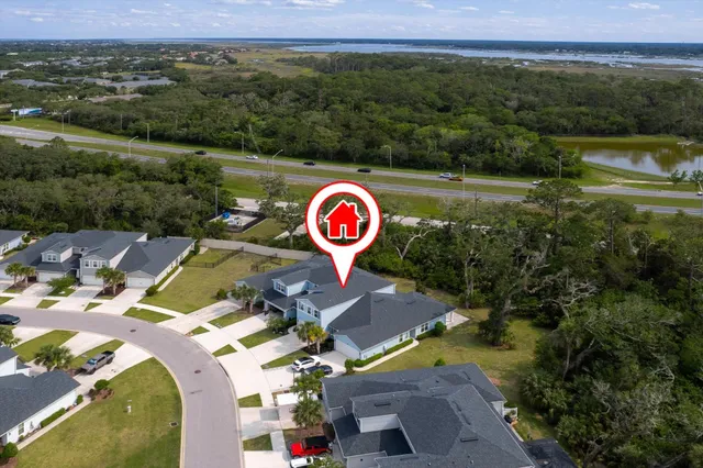 an aerial view of residential houses with outdoor space