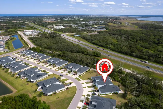 an aerial view of residential building and lake