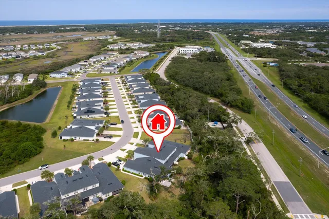 an aerial view of residential building and lake
