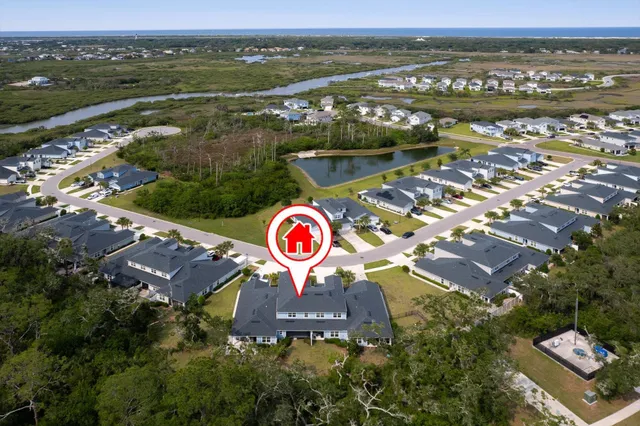 an aerial view of a house with a garden space