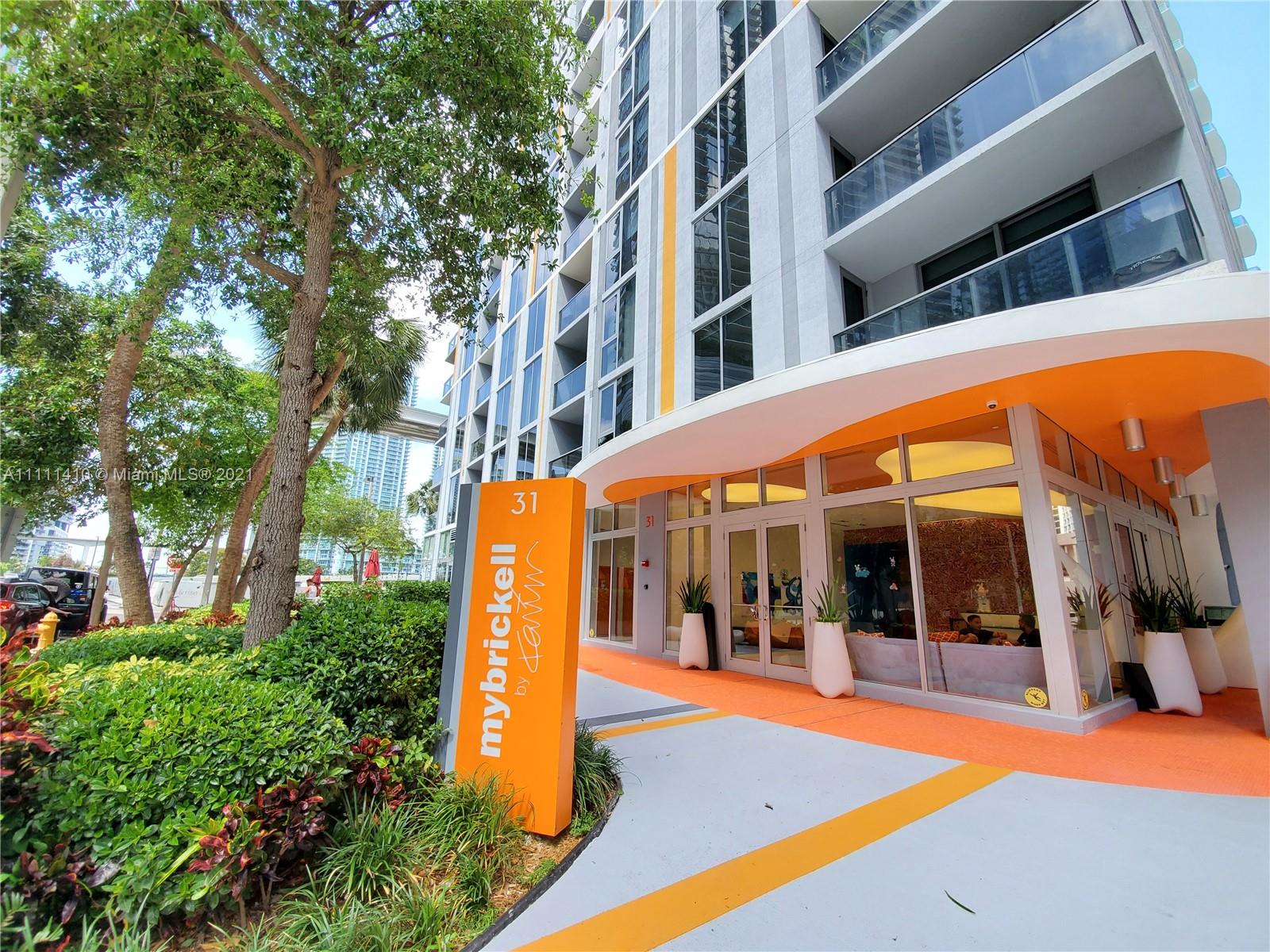 a view of a building with a yard