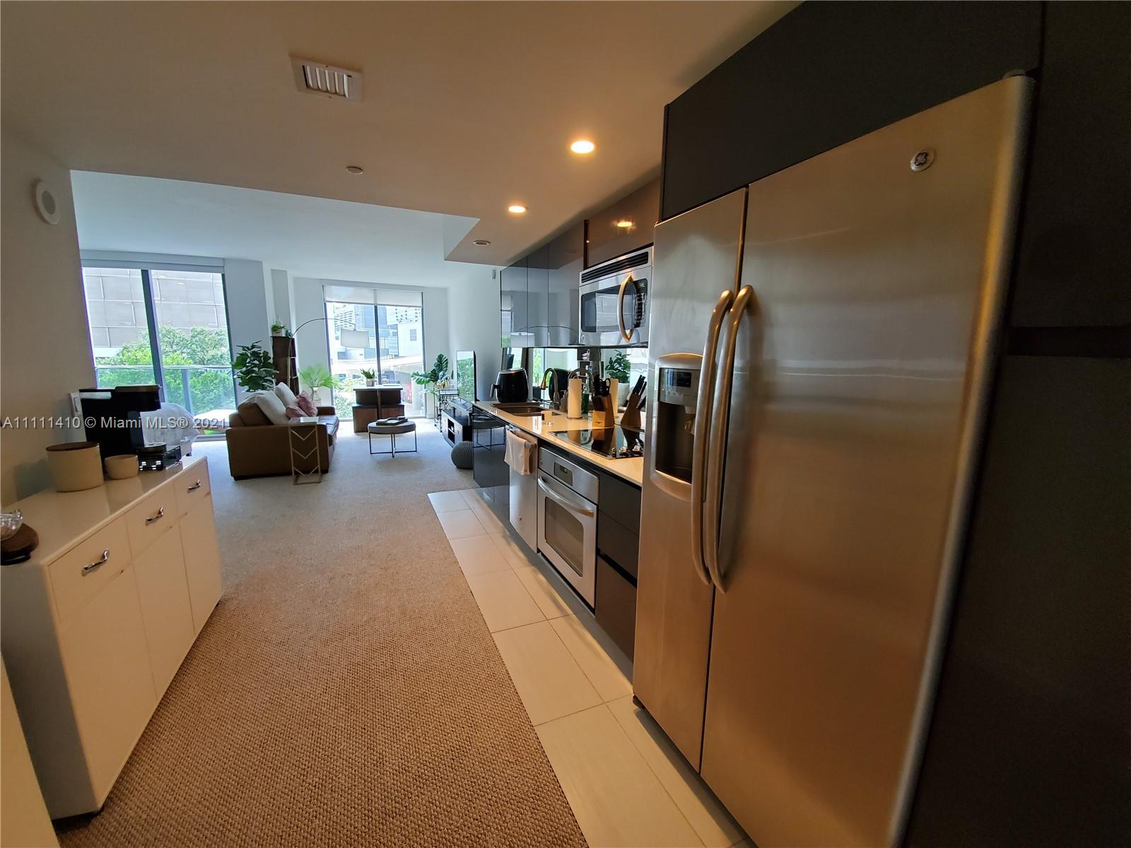 31 Southeast 6th Street, Unit 505 Miami, FL 33131 - Photo 2 of 71 a kitchen with stainless steel appliances a refrigerator and a sink