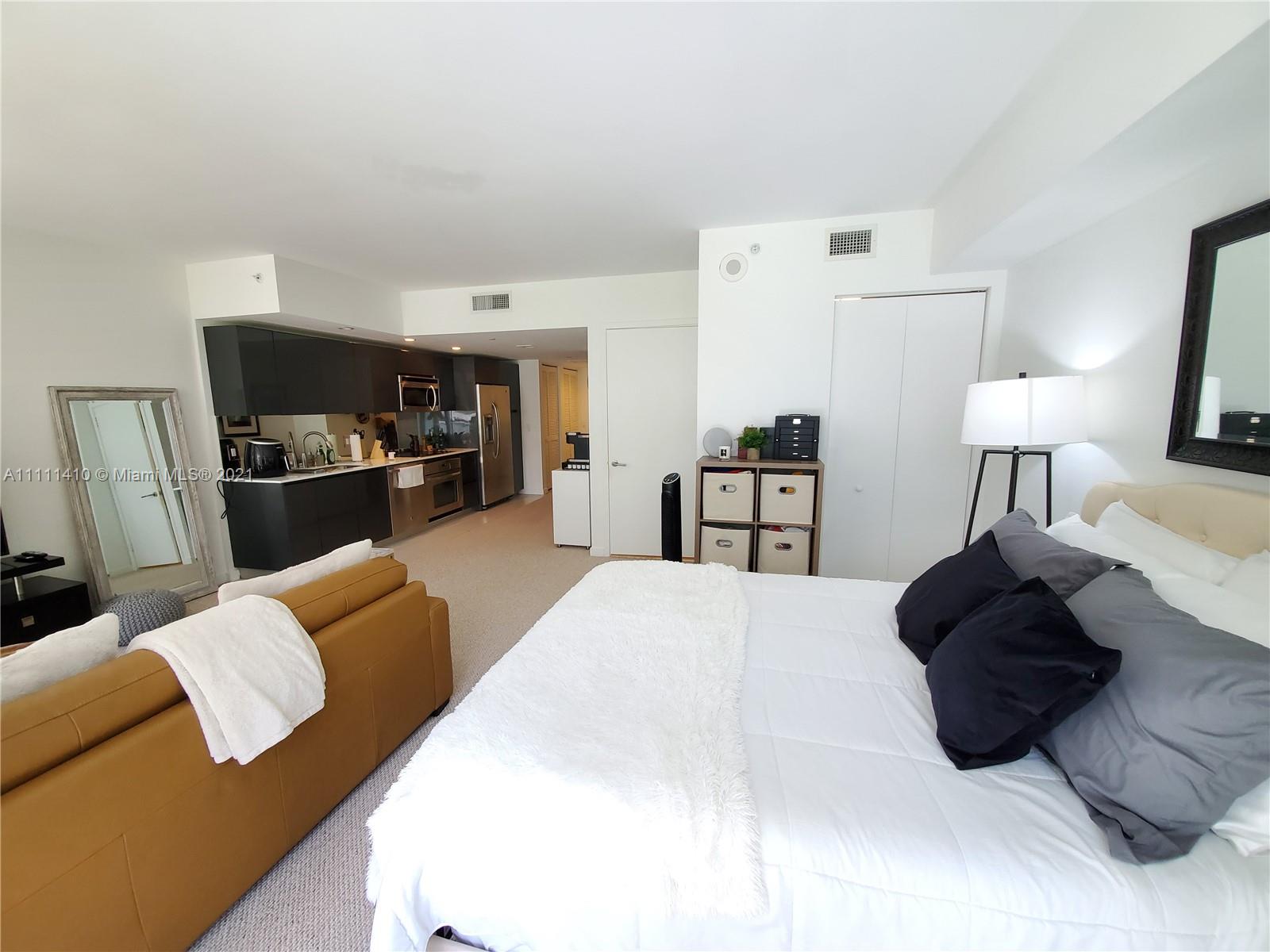 31 Southeast 6th Street, Unit 505 Miami, FL 33131 - Photo 11 of 71 a living room with furniture and a couch