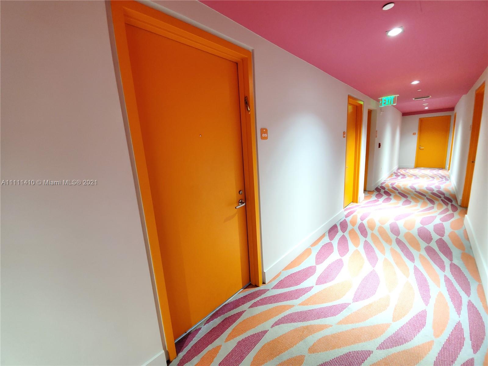 31 Southeast 6th Street, Unit 505 Miami, FL 33131 - Photo 28 of 71 a bedroom with a bed and a mirror