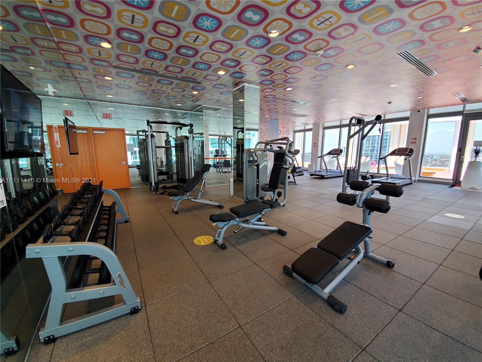 31 Southeast 6th Street, Unit 505 Miami, FL 33131 - Photo 37 of 71 a view of a room with gym equipment
