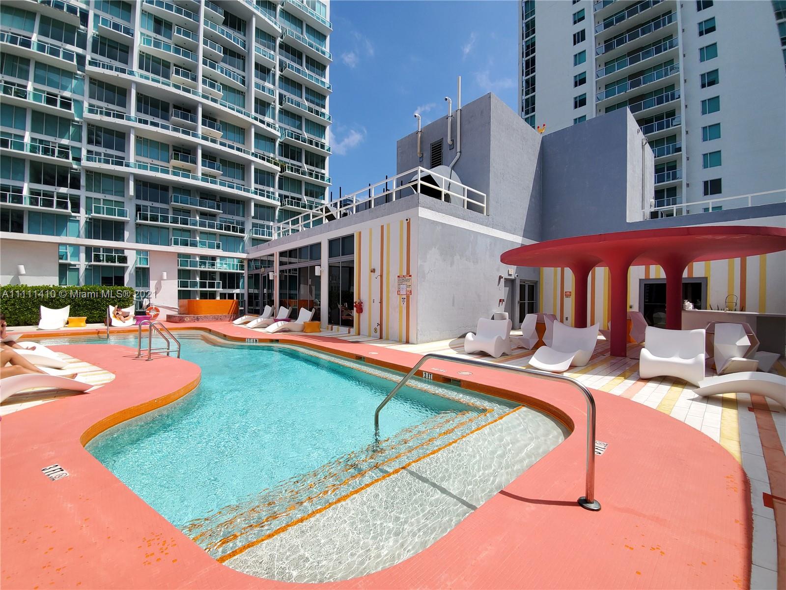 31 Southeast 6th Street, Unit 505 Miami, FL 33131 - Photo 41 of 71 a view of swimming pool with chairs