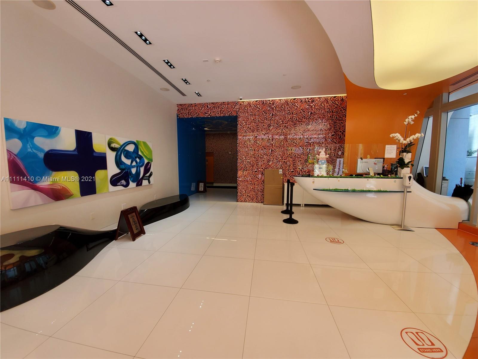 31 Southeast 6th Street, Unit 505 Miami, FL 33131 - Photo 44 of 71 a bedroom with furniture and a couch