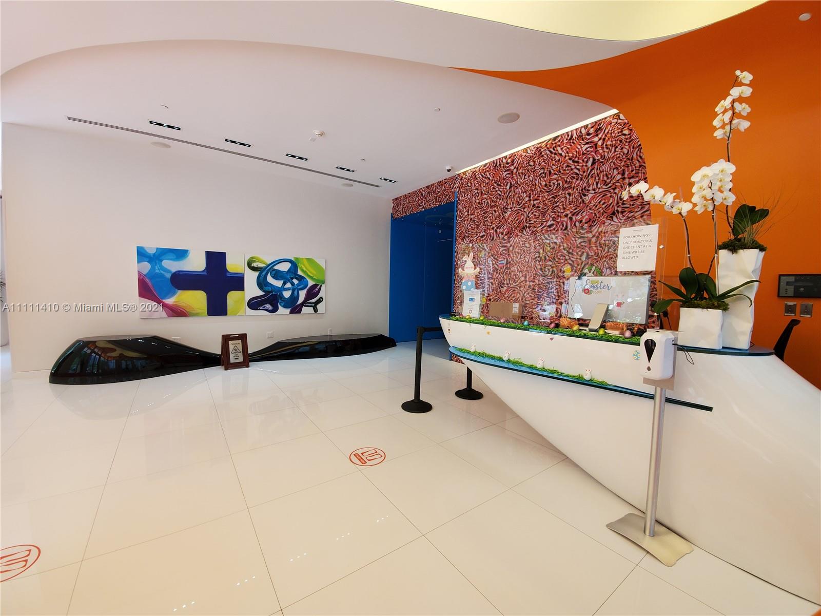 31 Southeast 6th Street, Unit 505 Miami, FL 33131 - Photo 45 of 71 a hallway with a table and chairs