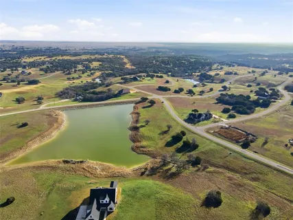 an aerial view of a house with a ocean view