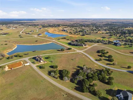 an aerial view of a house with a ocean view
