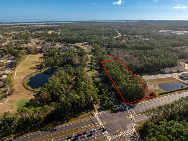 an aerial view of residential building with green space