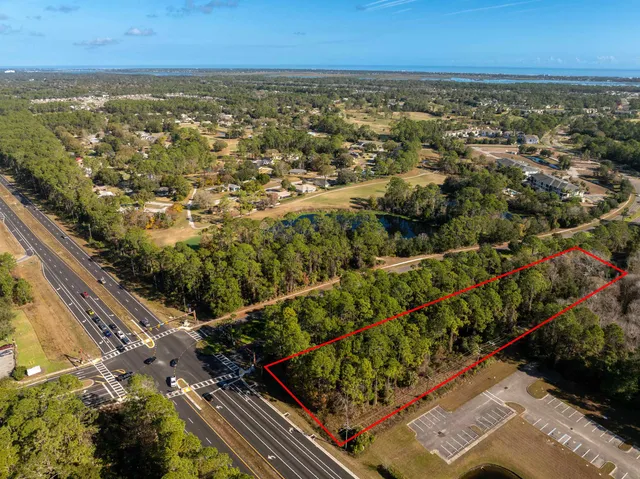 an aerial view of residential houses with city view