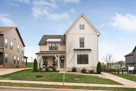 a front view of building with yard