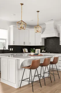 a kitchen with a table and chairs in it
