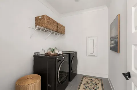 a view of storage and utility room with racks on the wall