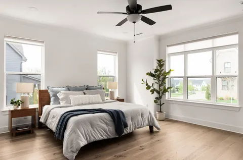 a bedroom with bed and a window