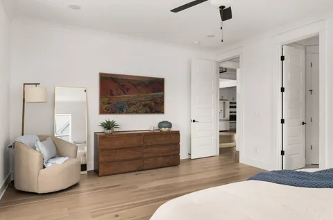 a living room with furniture and a dresser