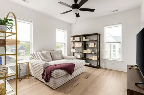 a bedroom with a large bed and a window