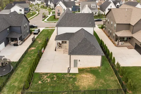 an aerial view of a house with a swimming pool
