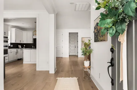 a view of a kitchen and an entryway