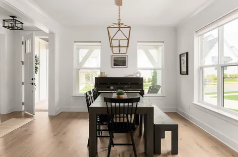 a dining room with furniture and window