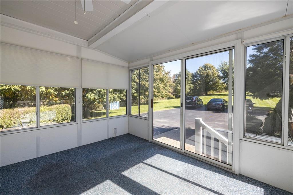 1741 Ridgewood Drive Washington, PA 15301 - Photo 20 of 45 ANOTHER VIEW OF THE SCREENED IN THREE SEASON ROOM WITH A VIEW OF THE EXTRA PARKING AREA.
