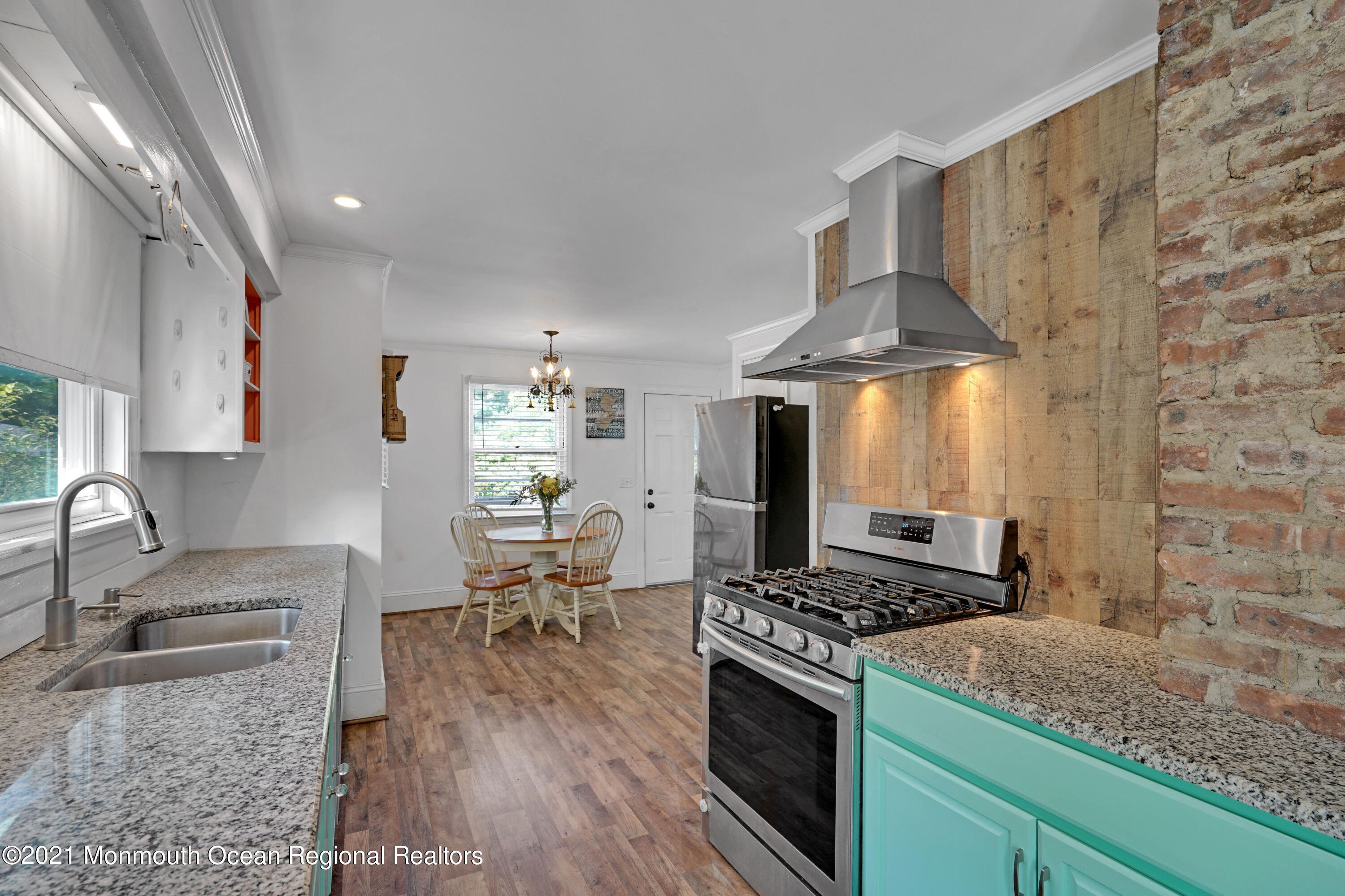 346 Cherry Quay Road Brick, NJ 08723 - Photo 11 of 27 a kitchen with stainless steel appliances granite countertop a sink stove and refrigerator