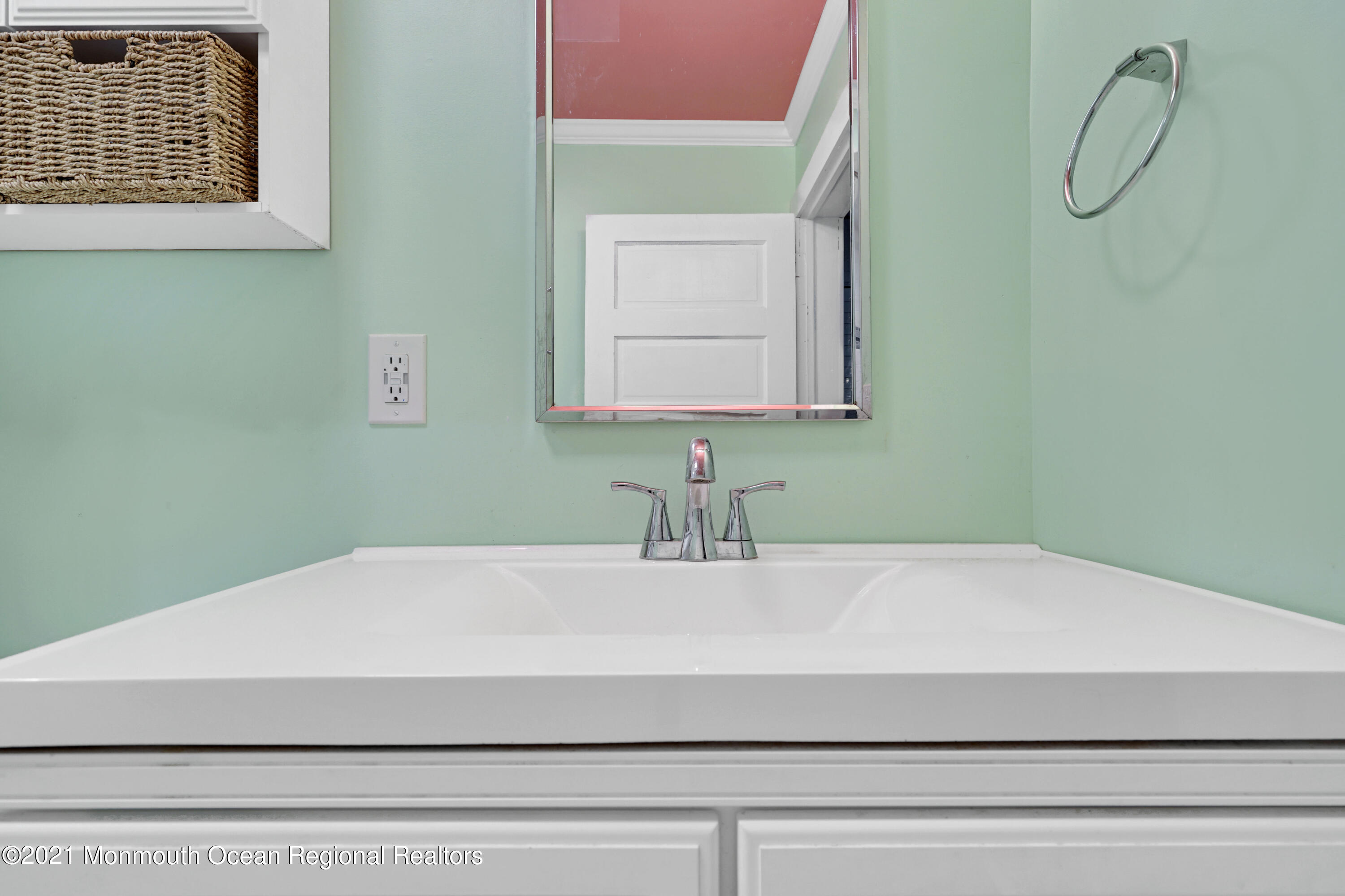 346 Cherry Quay Road Brick, NJ 08723 - Photo 19 of 27 a bathroom with a sink and a mirror