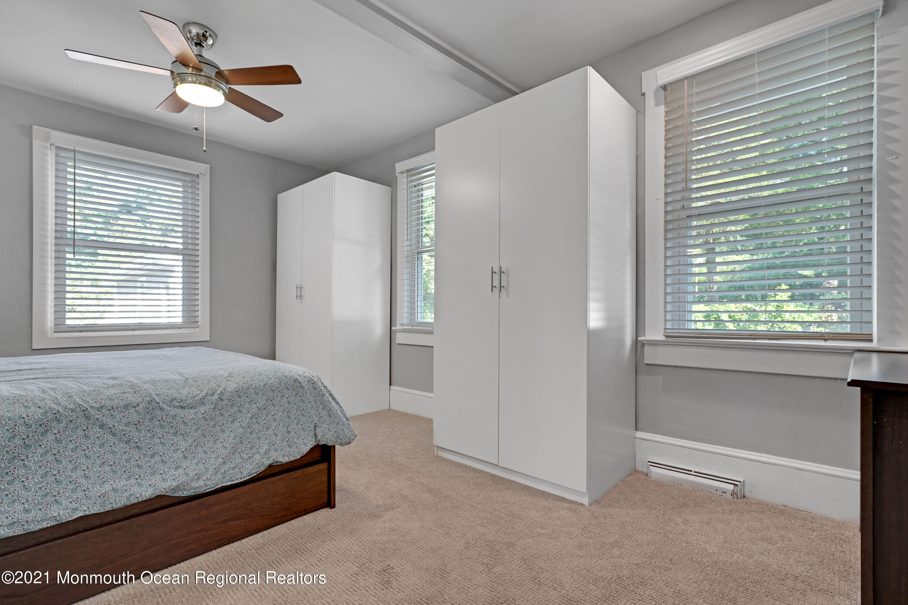 346 Cherry Quay Road Brick, NJ 08723 - Photo 20 of 27 a bedroom with a bed and a chandelier