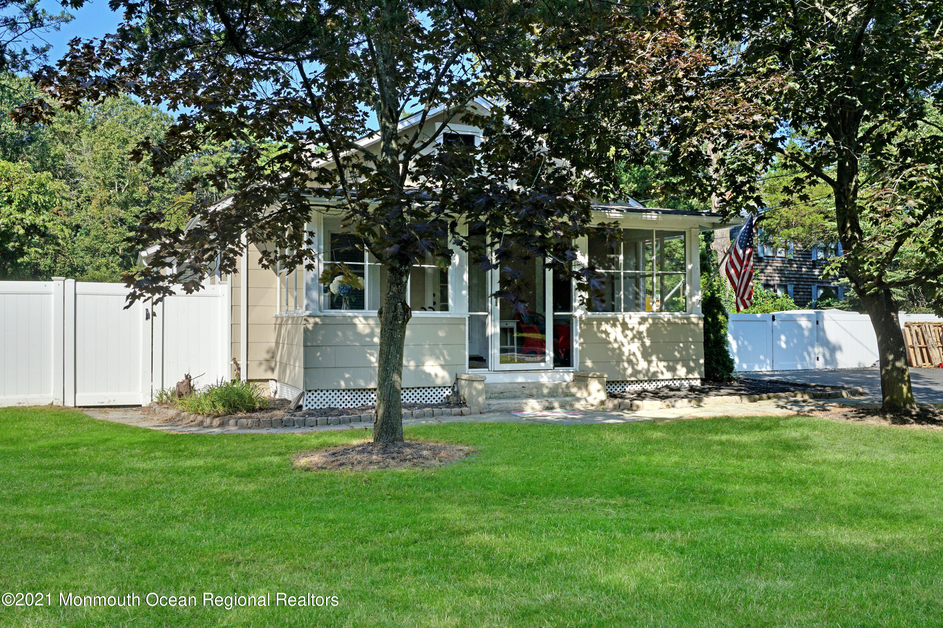346 Cherry Quay Road Brick, NJ 08723 - Photo 3 of 27 a front view of a house with garden and trees