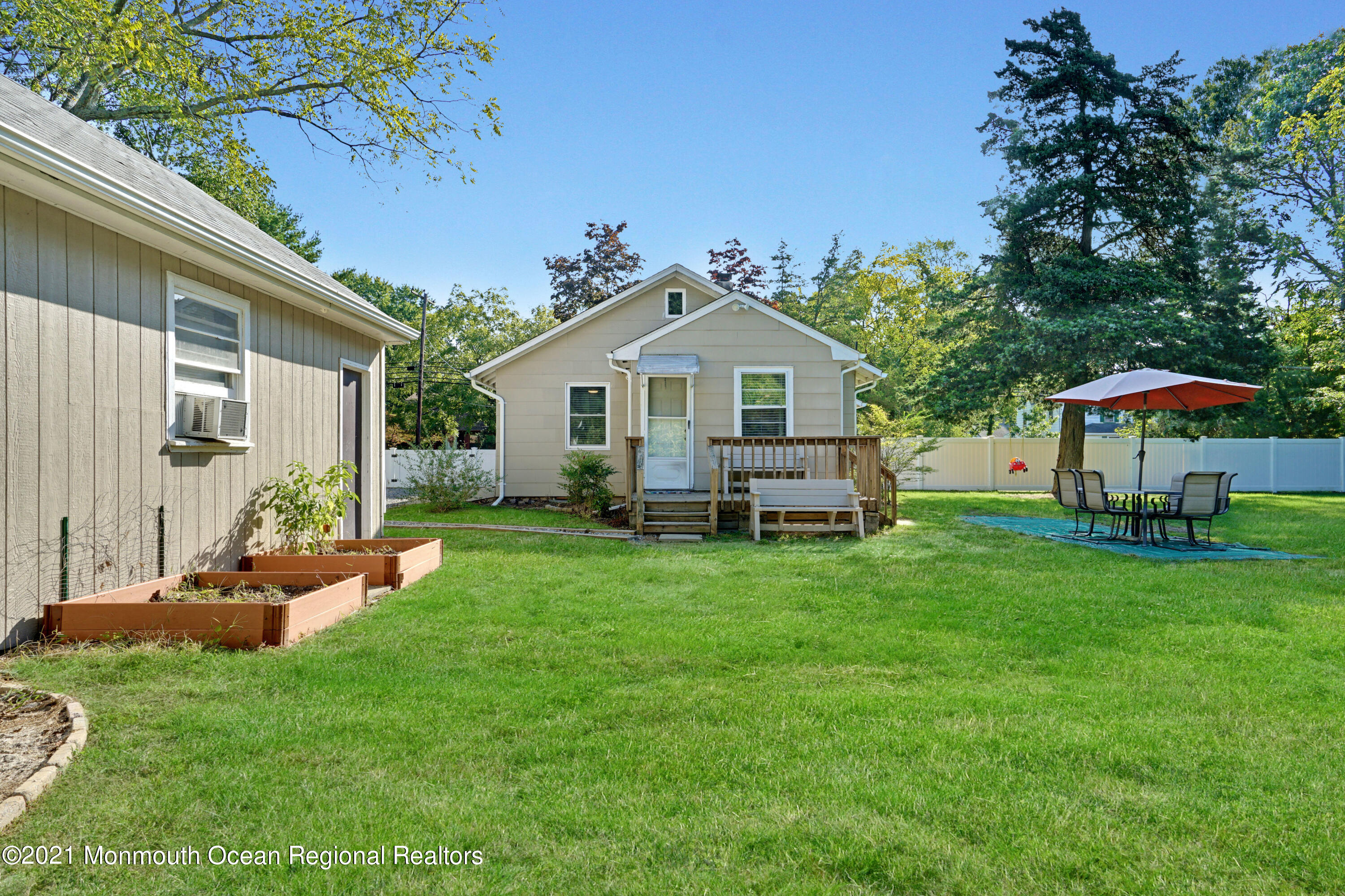 346 Cherry Quay Road Brick, NJ 08723 - Photo 25 of 27 a front view of a house with a garden