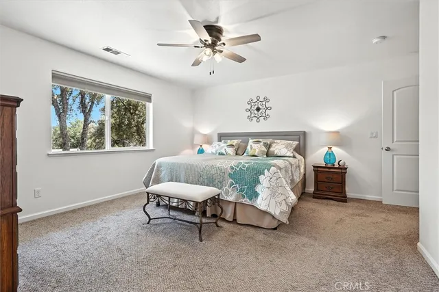 a bedroom with furniture and a window