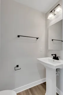 a bathroom with a sink a vanity and a mirror