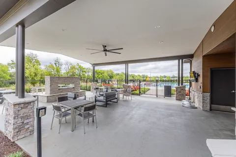 a view of a house with a yard and lake view